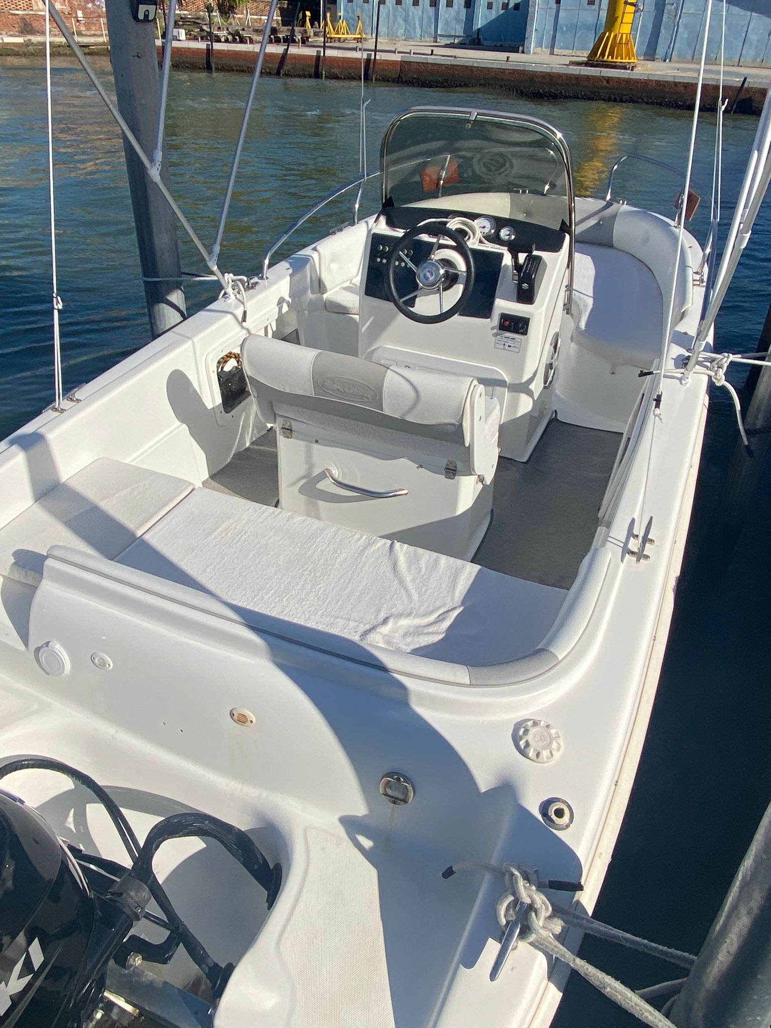 White stern seating and central steering console of the Venetian Boat, viewed from above