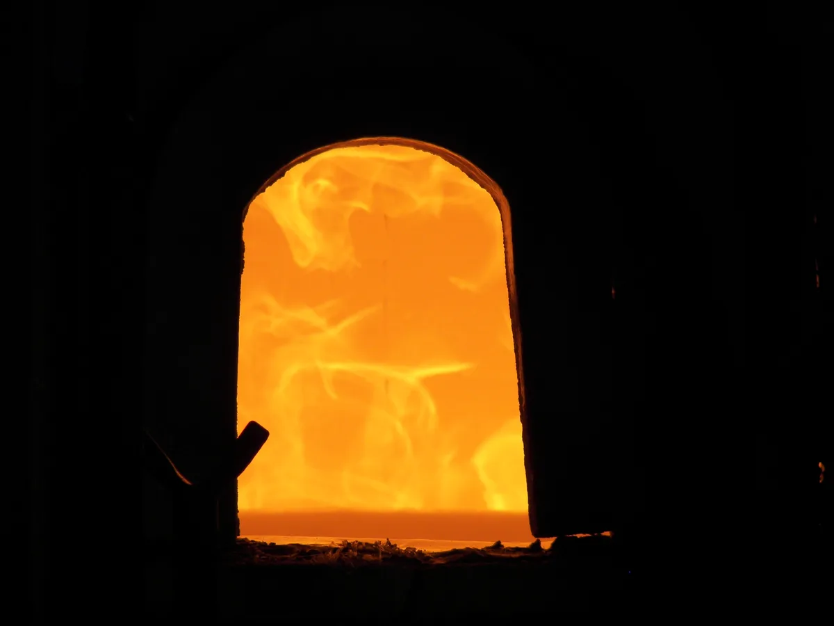 The glowing opening of a glassmaking furnace in Murano; illustrative photograph